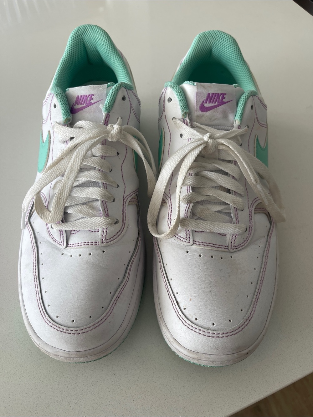 Nike White Sneakers with Mint Swoosh and Purple Accents